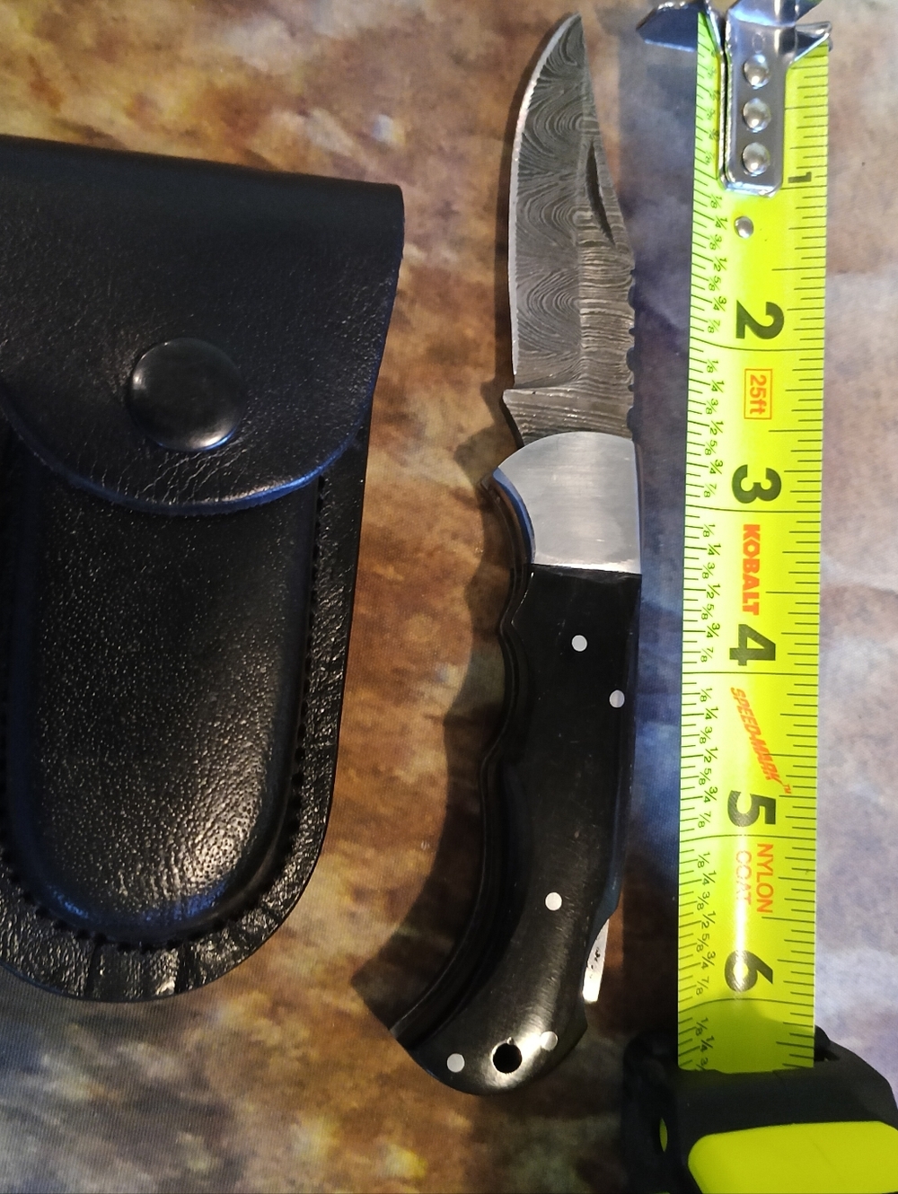 Damascus Steel Pocket Knife With Buffalo Horn Handle And Leather Sheath.